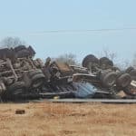 Truck carrying calcium chloride overturns