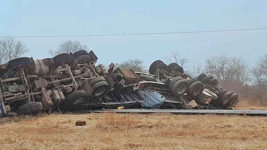 Truck carrying calcium chloride overturns